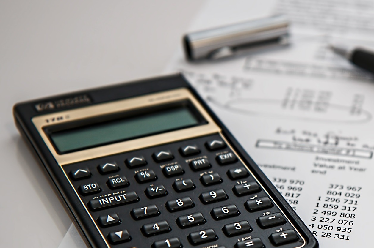 Calculator on a spreadsheet by a pen